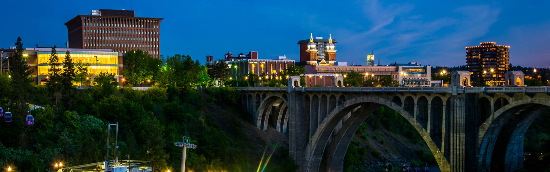 Neon color image of a band playing and people singing along