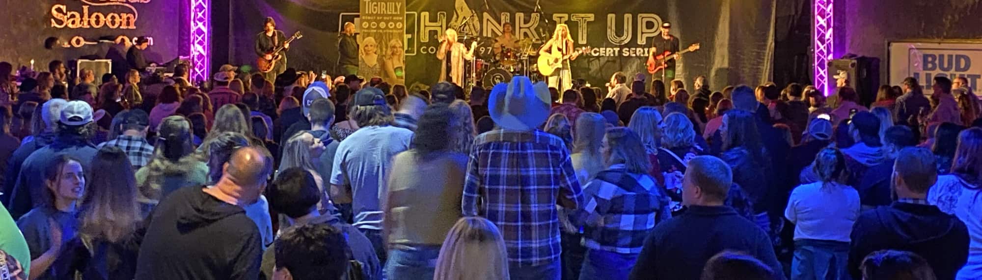 country concert with fans wearing cowboy hats Spokane
